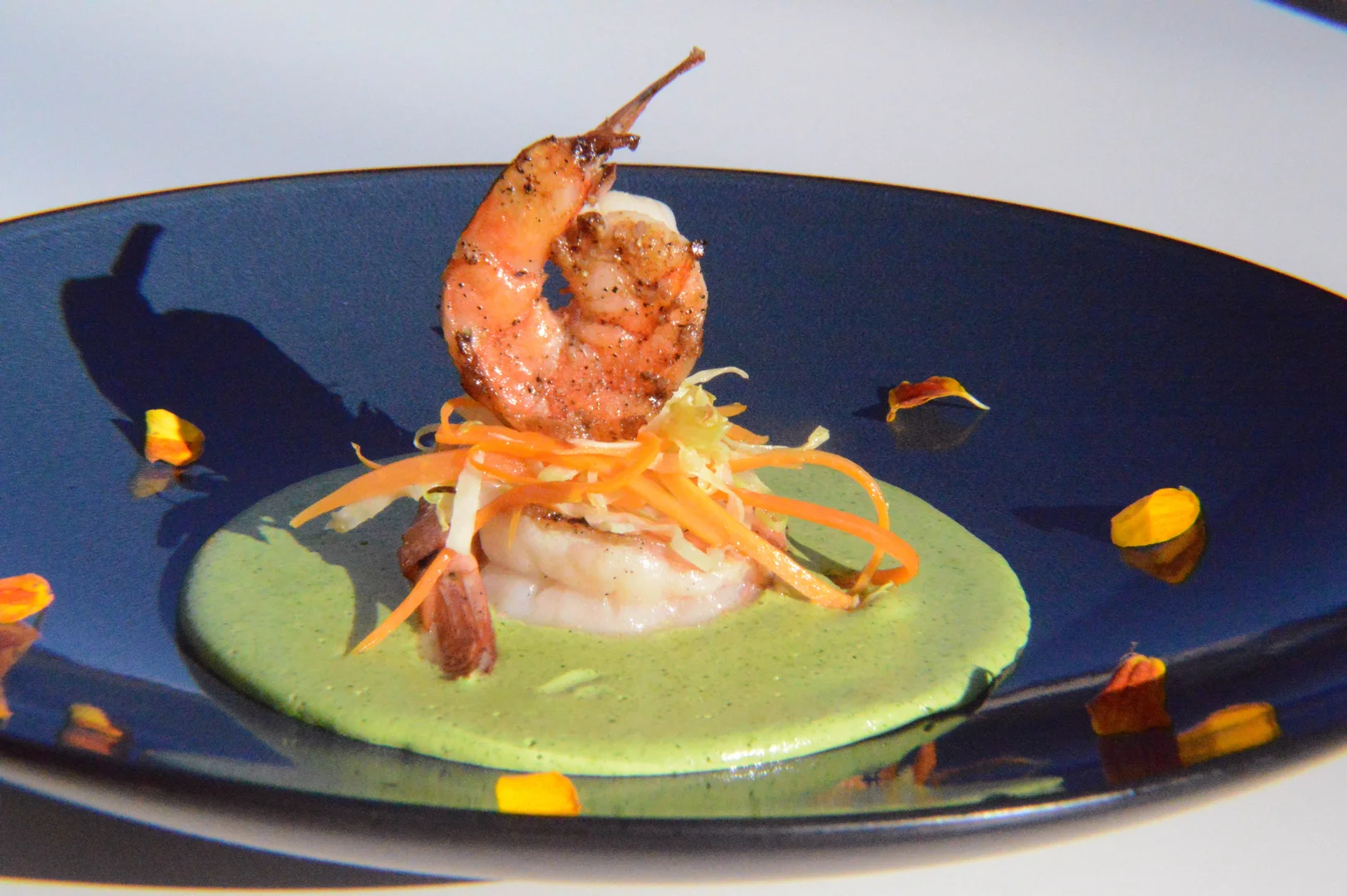 XIM shrimp dish presented on a blue plate