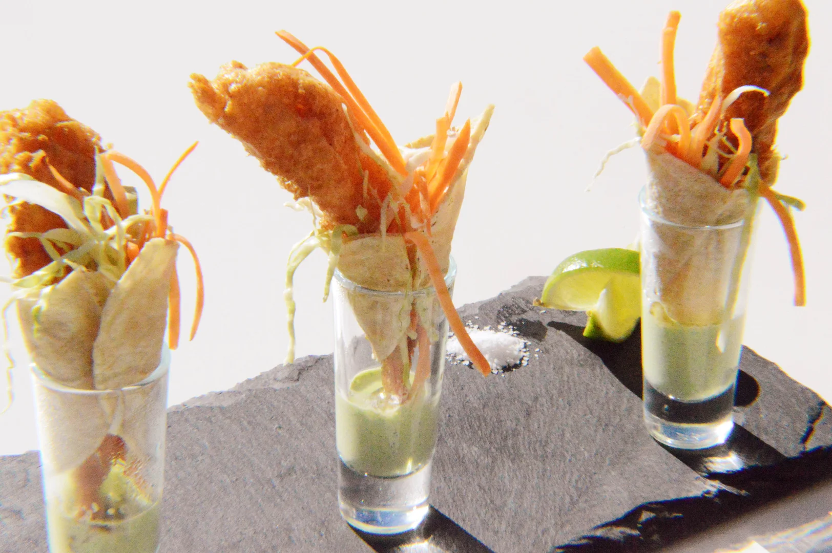 Three XIM shrimp appetizers served in individual glasses