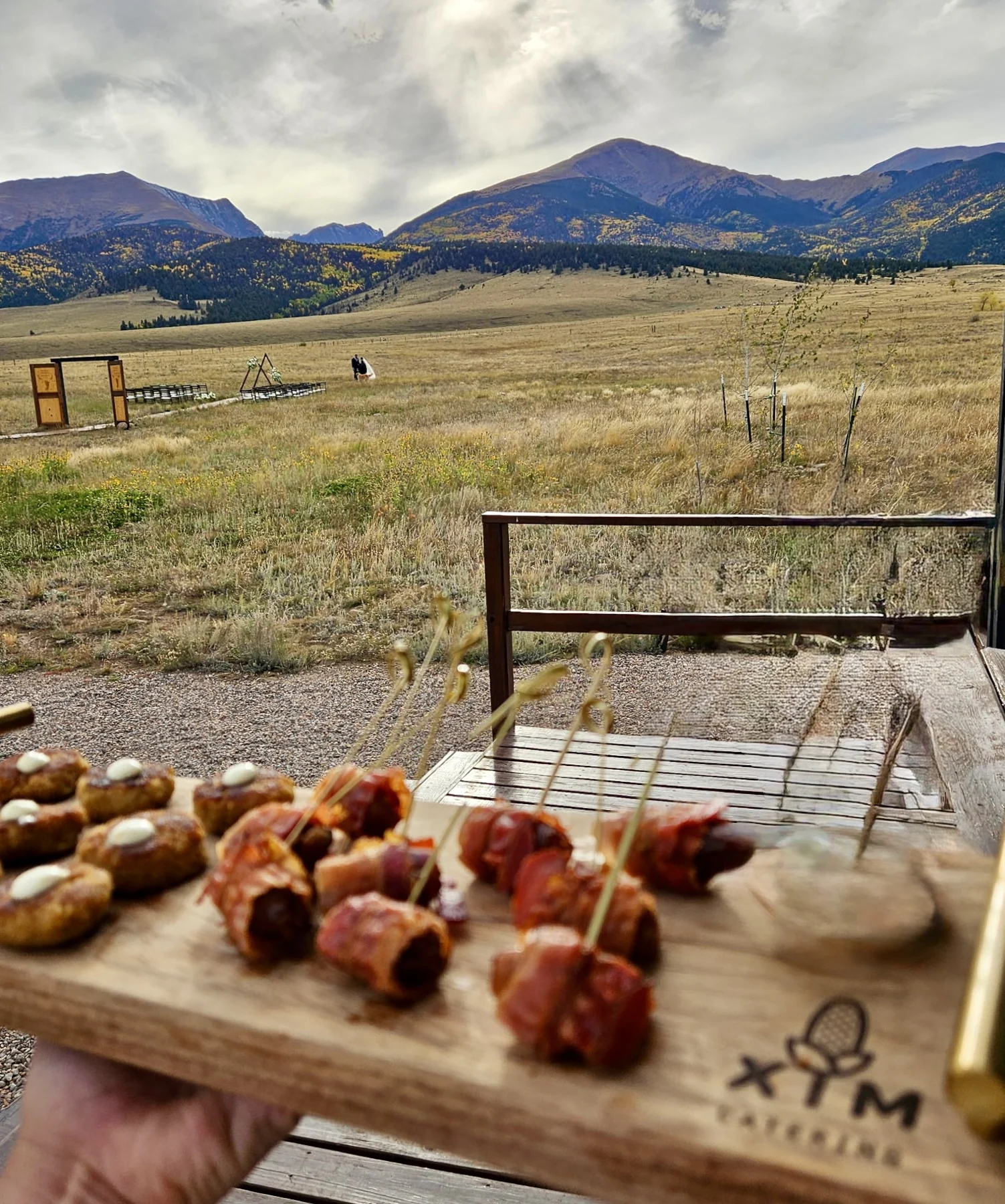 Passed appetizers overlooking a mountain wedding ceremony
