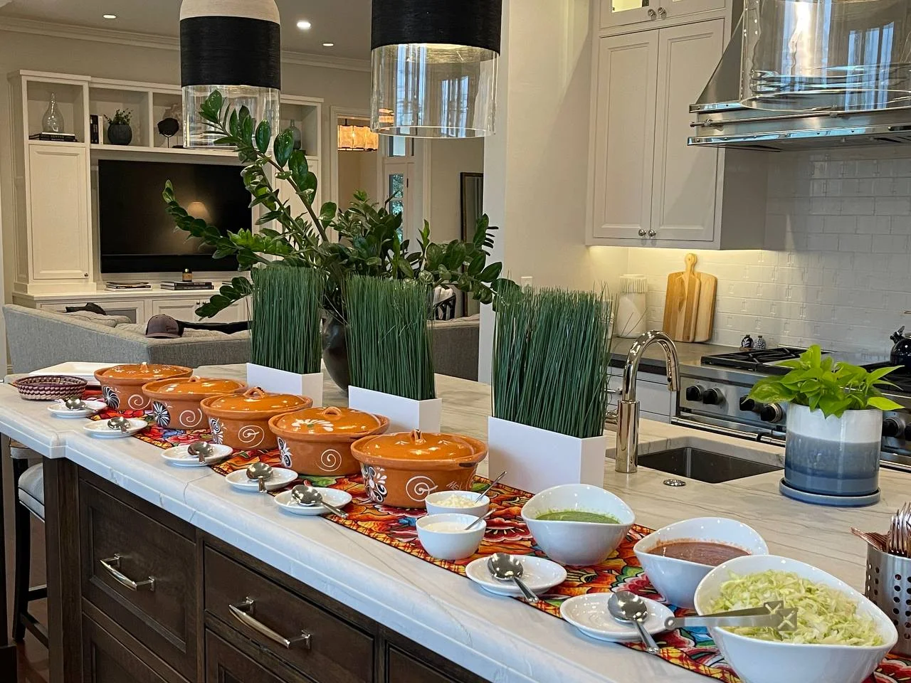 Taco bar with terracotta serving pots and fresh toppings